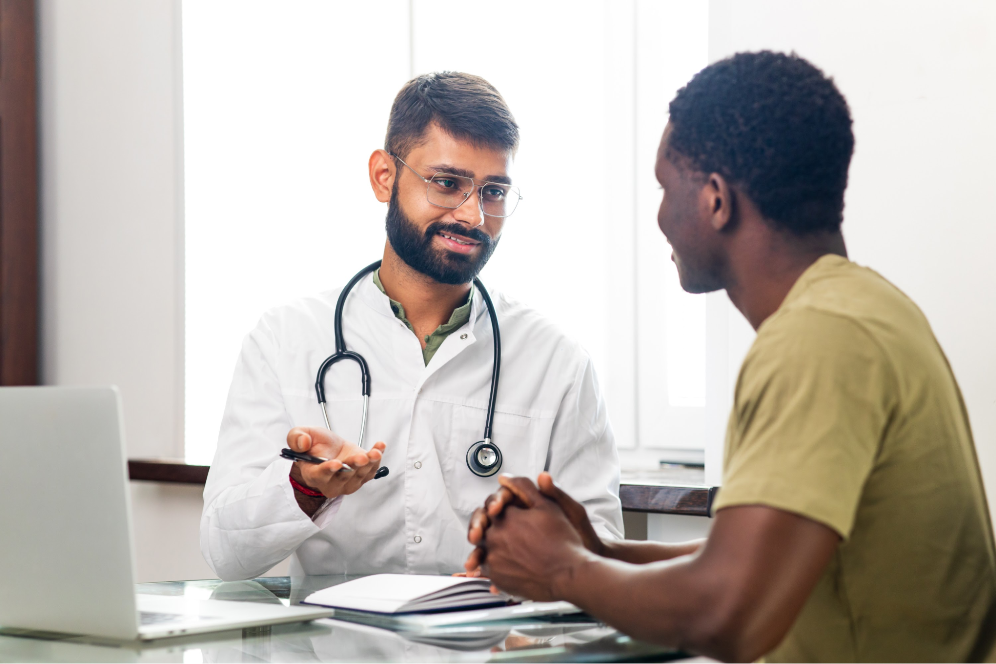 A doctor talking to a male patient.