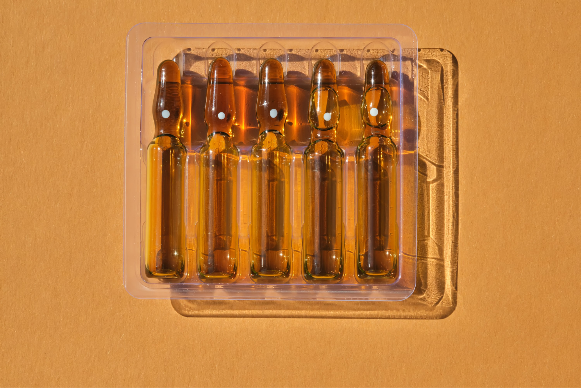 Glass ampules holding vitamins