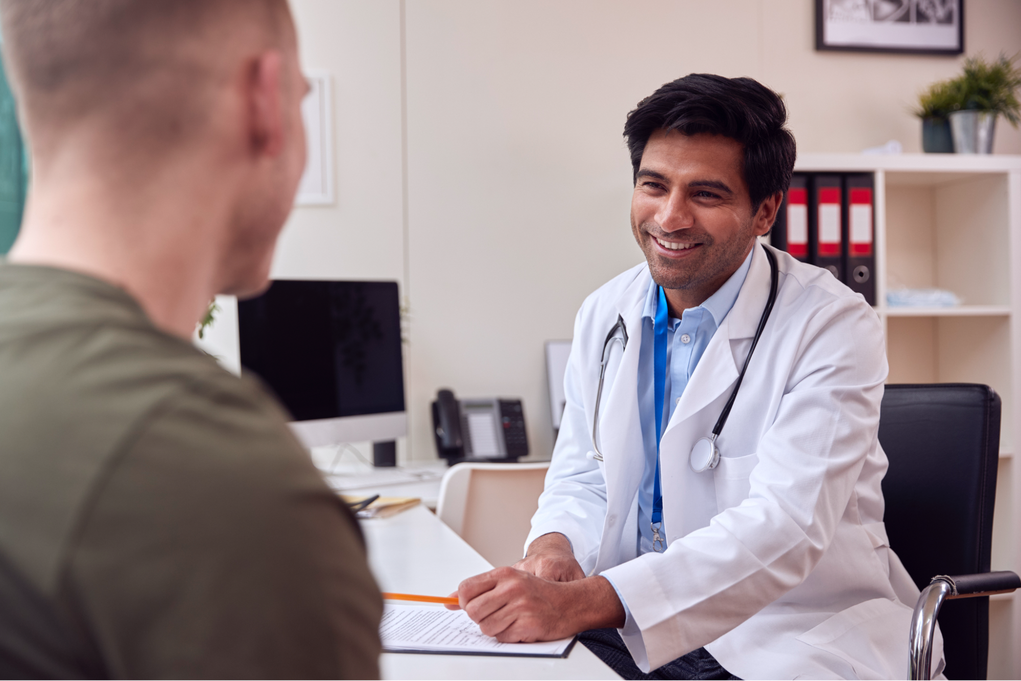 A man consulting with his doctor.
