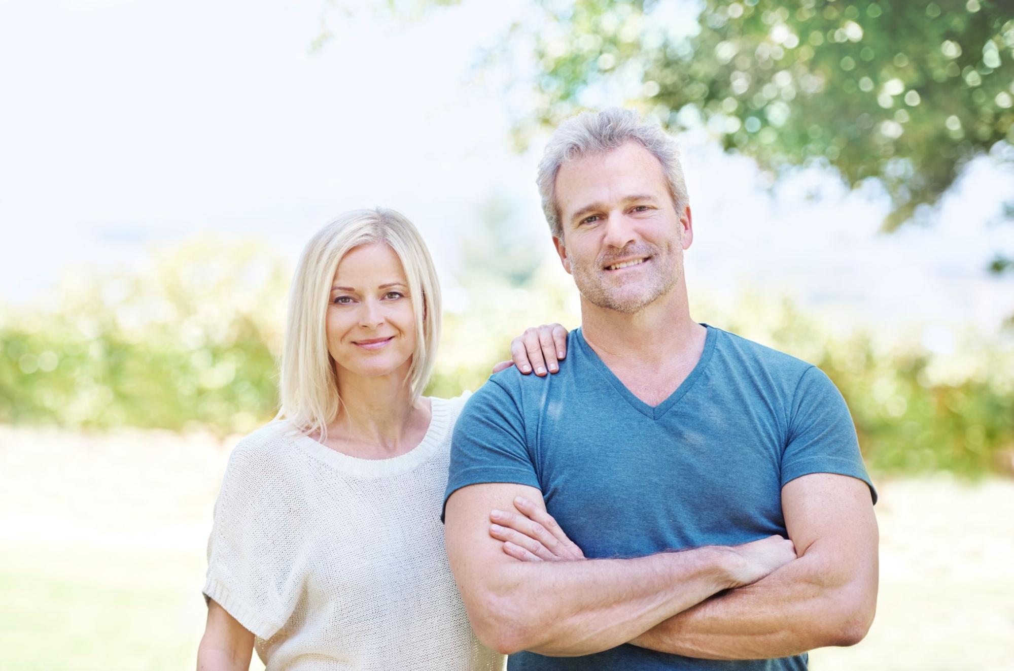 A couple enjoying a joyful moment, showing renewed connection after HRT for men.
