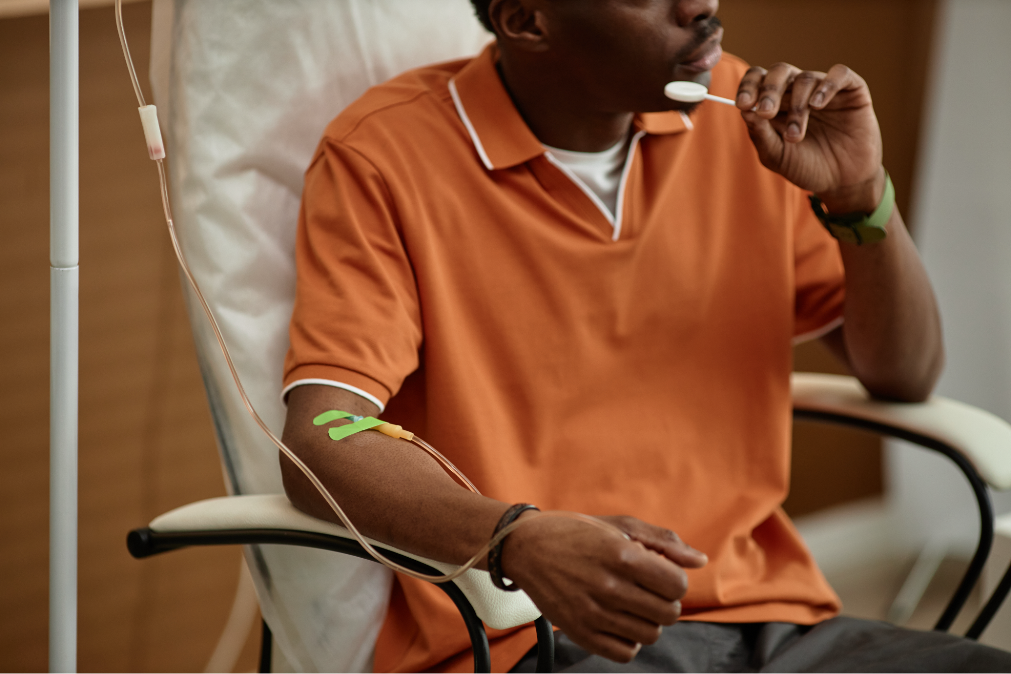A man receiving IV therapy.